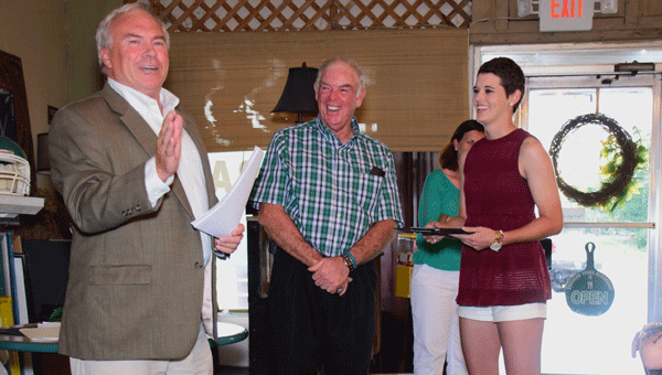 Pictured are, from left to right, Donald Nix, Crenshaw County Chamber of Commerce President; BHS coach Jimmy Johnson; and BHS softball player Alex Wilcox receiving an award. 