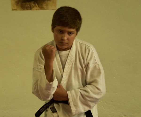 Fourteen-year-old Ben Hughes has successfully attained his black belt. (Photo by Beth Hyatt) 