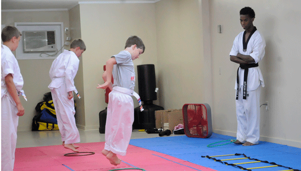 The Jr. White Belts class of Docarmo’s Taekwondo Center prepared for their upcoming lesson Thursday afternoon.
