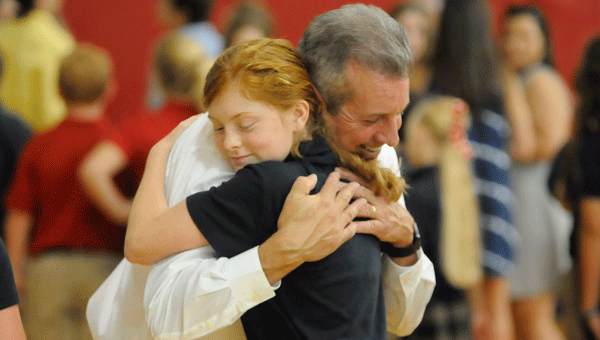 John Halligan hugs one of his more attentive listeners during Monday afternoon’s special presentation.  Halligan, whose 13-year-old son committed suicide in 2003 as a result of bullying, has been traveling the nation in an effort to prevent bullying by speaking to students and parents at high schools across the country.