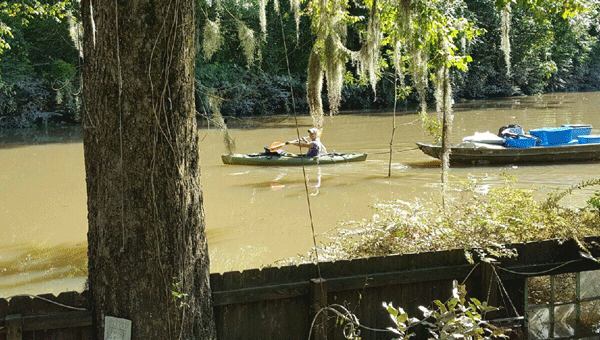 Dr. Amy Grayson delivers supplies to a flooded Lousiana neighborhood via kayak in the wake of severe flooding to the area this past week.