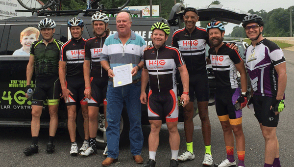 Seven cyclists made their way through the Camellia City for the sake of Gabe Griffin, an 11-year-old suffering from Duchenne muscular dystrophy. Photographed, from left to right: Charles Catterall, Peter Blessey, Wes Bates, Greenville Mayor Dexter McLendon, Michael Staley, Demetrious White, Brian Toone and Greg O’Connor. 