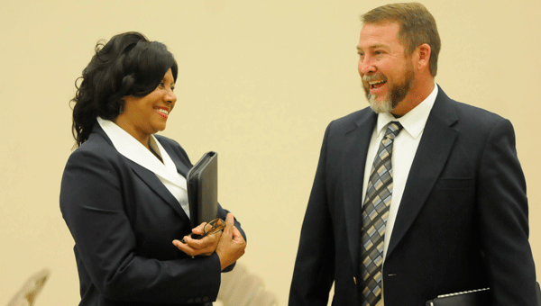 Butler County Board of Education president Mickey Jones (right) welcomes the newly-announced Lois Robinson as a member of the board during Monday night’s meeting.