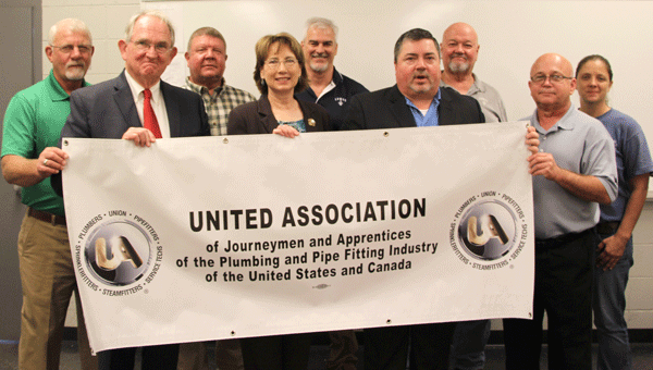 Attending the recent event sealing an articulation agreement with LBW Community College and United Association were, front row from left, LBWCC Vice President Dr. Jim Krudop; Dean of Instruction Peggy Linton; Lance Albin, UA international representative; Samuel Bankester, South Central Pipe Trades field representative; second row, Randall Kelly, retired field representative and current instructor for Local 372 Training Center; John Paul Smith, business manager with the Plumbers and Steam Fitters Local Union 52; LBWCC welding faculty Scott Cooper and David Brawner; and Chelsea Wyatt, welding laboratory facilitator.
