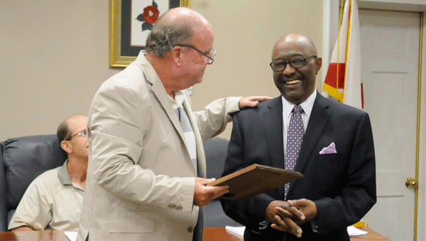 Greenville Mayor Dexter McLendon (left) presented longtime Greenville City Councilman Jeddo Bell with recognition he received earlier this year as an Outstanding Graduate of the Andalusia City School System. 