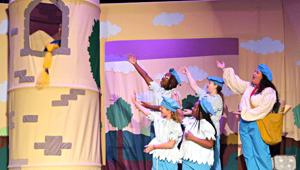 Frenchie (Gaby Fernandez) and the wood elves (Iyunna Burnett, Amelia Gregory. Lillybeth Oswald and Janiya Norris) direct their attention to Rapunzel’s tower.