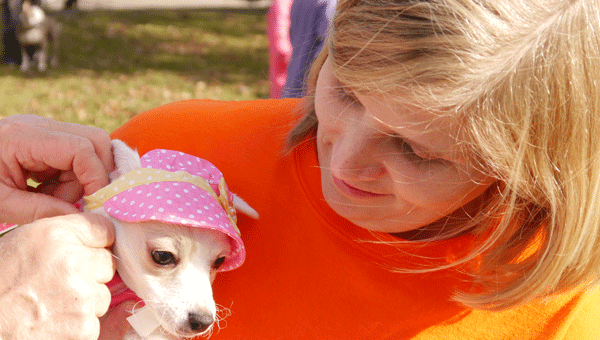 Stephanie Blue holds her dog, Lilly, during a recent Bark in the Park event.