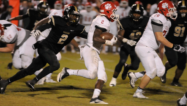 Greenville defensive back Bishop Riley gives chase behind Eufaula running back Jujuan Whigham during Greenville's 28-7 loss to Eufaula.