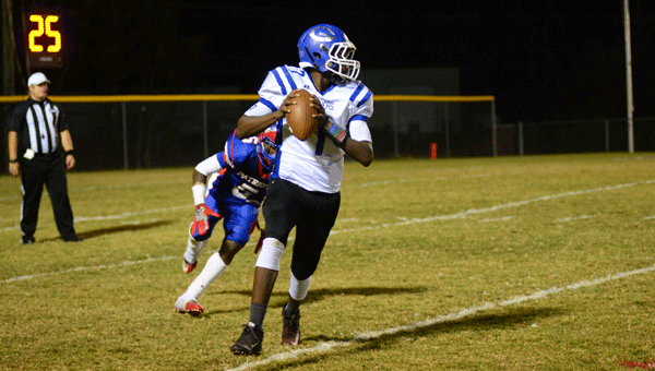 Georgiana quarterback Jamarcus Sims scrambles to avoid a Linden defender in the Panthers’ 52-13 loss to the Patriots.