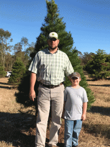 Pictured are Matthew (left) and Wyatt (right) Pippin at their tree farm on Fowler Road in Luverne. 