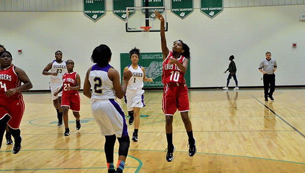 Pictured is the LHS Lady Tigers team taking on the Goshen Eagles in the recent Christmas tournament held at Brantley High School. 