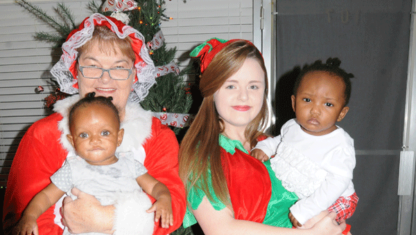 Mrs. Claus (Joann Mathews) and Santa’s Elf (Hannah Piggott) visited with children and their families at Kiwanis Club’s annual Christmas party.  