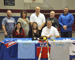 Last Tuesday,  Crenshaw Christian Academy senior (center) Katlyn Gamble signed to play softball with Chattahoochee Valley Community College.  Gamble will receive a full-tuition scholarship.  Gamble is pictured with her parents, coaches and other faculty members of CCA. 