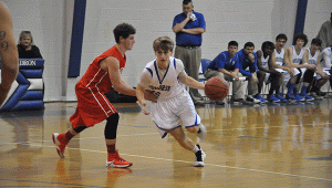 Pictured is HHS junior Connor Price charging past the Zion Chapel Rebels. 