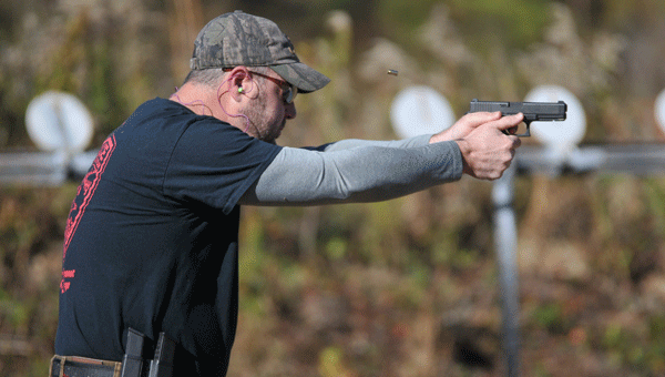 Poarch CreEk Police Department officer Steven Bradley takes aim during the 8th annual GPD-hosted Steel Challenge Friday.