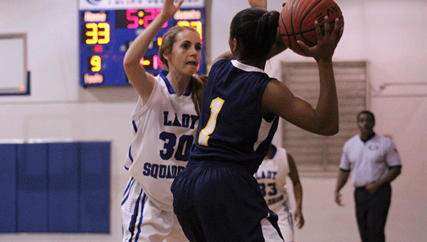 Pictured is HHS Lady Squadron 8th grader Jeci Taylor guarding a Lady Tiger. 