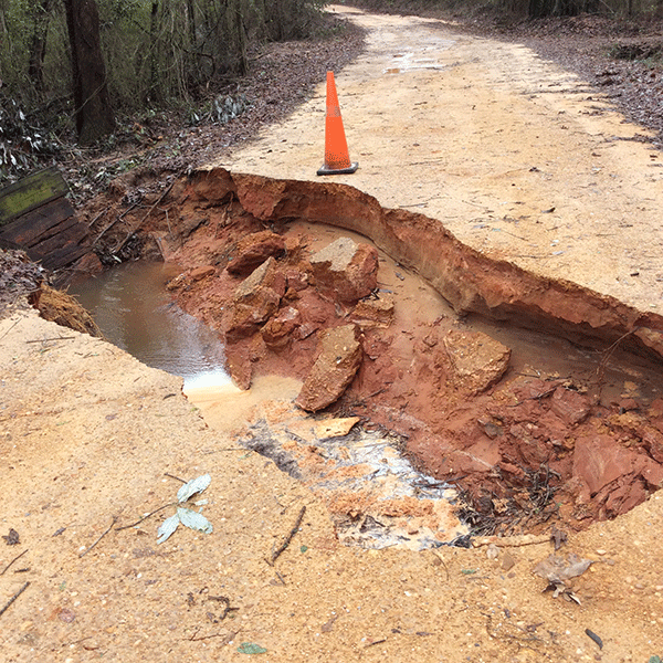 Pictured is a portion of Ballard Road, an unpaved road, that was washed away after the storms that came through on Monday. 