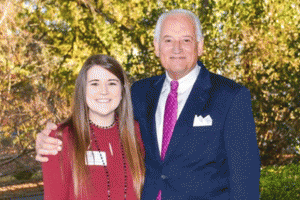 Pictured is Mallory Jones with Dr.  Jack Hawkins, Jr. ,  Chancellor of  Troy University,  when she was named Who’s  Who Among Students in American Universities and Colleges. 