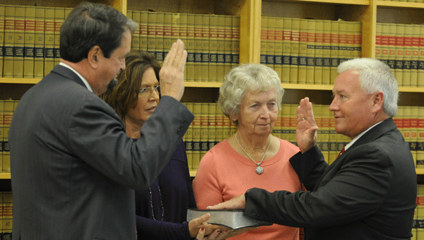 Butler County Commissioner Joey Peavy was recently sworn in for his second term.  Also in attendance was his mother, Belle Peavy, and his wife, Lisa Peavy.