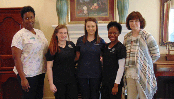 Martina Savage (far left) and Melissa Stringer (far right) of Pine Needle Place offer work experience for Monica Smith (Georgiana), Lindsay Nichols (Greenville) and Tylishia Walton (Georgiana).