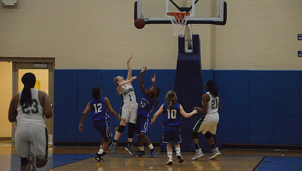 Pictured are the Brantley High School Lady Bulldogs in the midst of the area tournament at Georgiana. The Lady Dogs took on the Highland Home School Lady Squadron for the first round of the tournament, and came home with a 50-23 victory.  Journal Photo/Katie Silva
