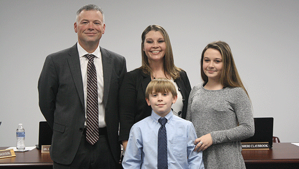Pictured are, from left to right, Phillip, Faith, Kylie and Kaden Coggins. Phillip Coggins was hired as the football coach for Highland Home School on Monday night at the Crenshaw County Board of Education meeting. Journal Photo/Shayla Terry 
