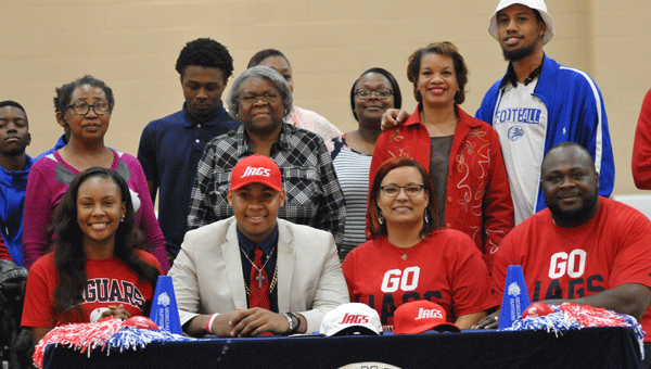 Ezekiel “Zeke” Powell signed a full scholarship to attend the University of South Alabama Wednesday at R.L. Austin Gynmasium.  Powell will join the Panthers as a member of the offensive line.  His sister, Courtney Powell, his mother, Candice Powell, and his father, Ezell Powell, joined him at the signing table, as well several other family members.