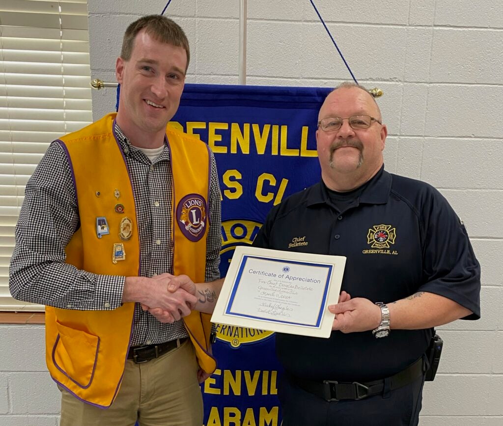 Greenville Fire Chief Douglas Belletete speaks to the Greenville Lions Club. Pictured are (left to right) club president David Lovell and Douglas Belletete. Photo submitted.